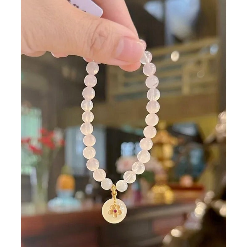 Natural powder crystal safety buckle bracelet, white chalcedony flower pendant, pink crystal bracelet.