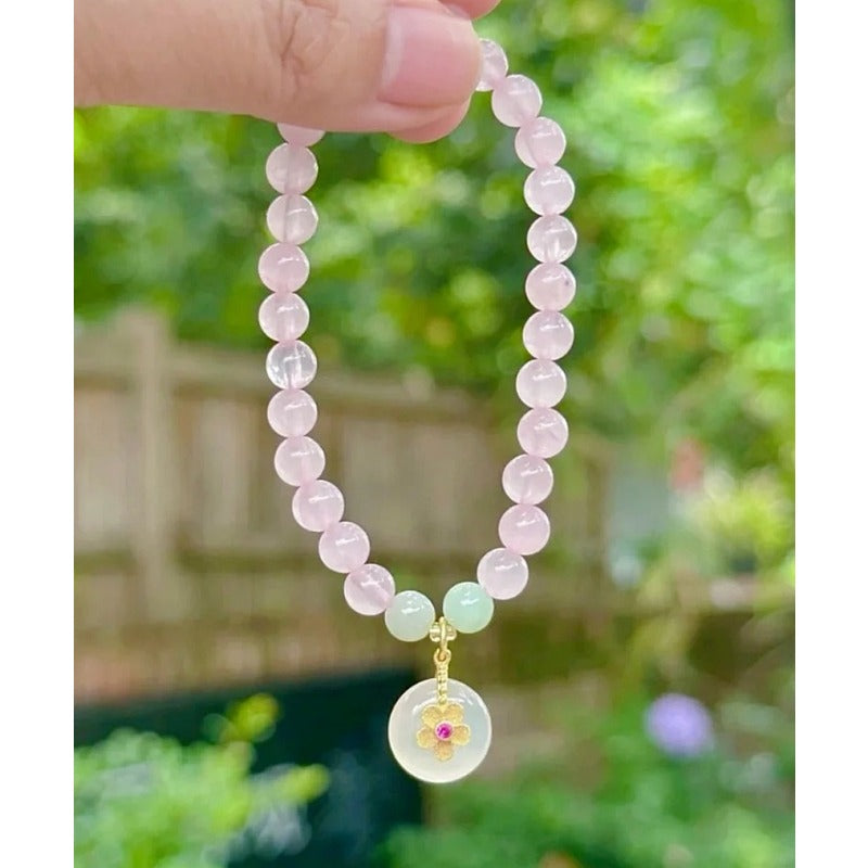Natural powder crystal safety buckle bracelet, white chalcedony flower pendant, pink crystal bracelet.