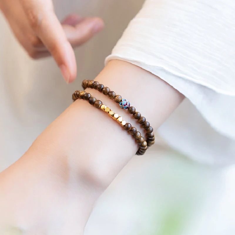 Sandalwood bracelet stacked with three rings of 6mm calming and stable bracelet