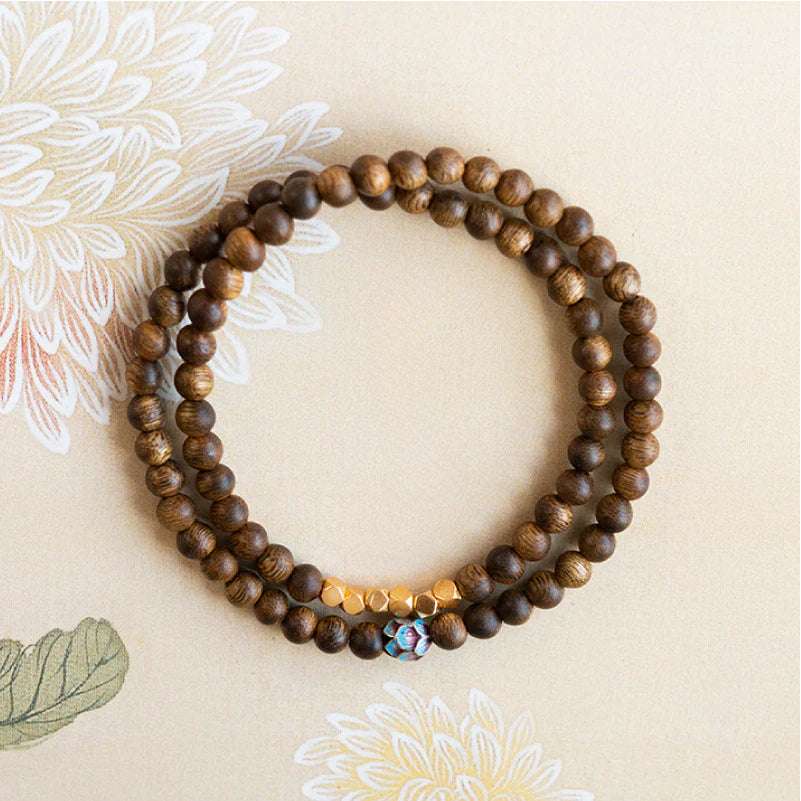 Sandalwood bracelet stacked with three rings of 6mm calming and stable bracelet