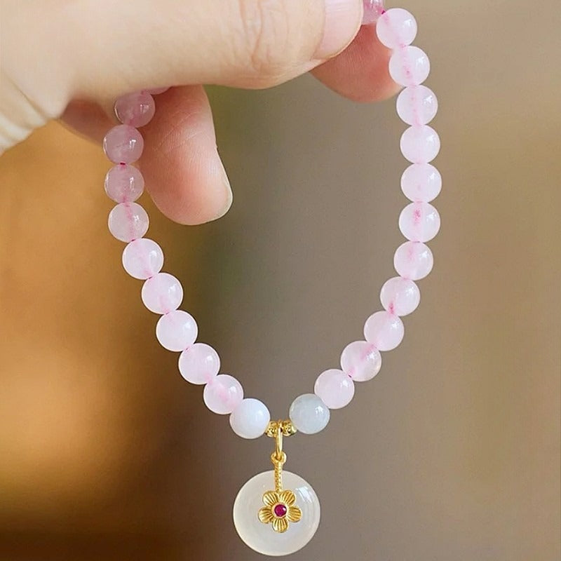 Natural powder crystal safety buckle bracelet, white chalcedony flower pendant, pink crystal bracelet.